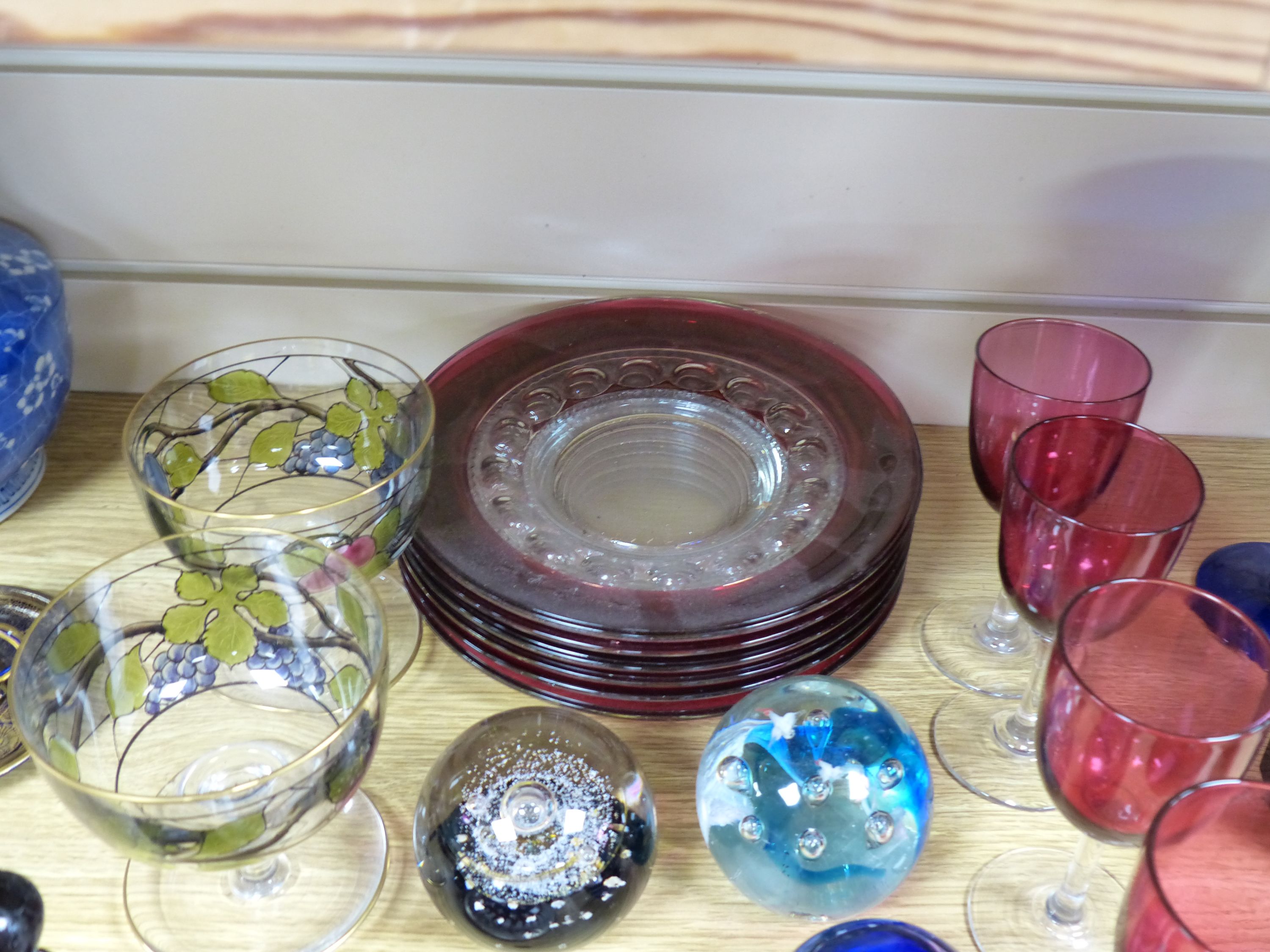 A quantity of mixed coloured glass and paper weights